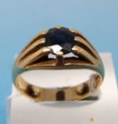 An 18ct gold ring set with a large sapphire (size Q)