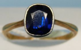 An 18ct gold ring set with an cushion cut sapphire (size L)