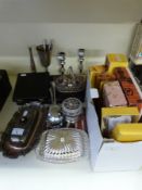 A quantity of silver plated ware including candlesticks, boxed cutlery, butter dishes,