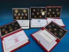 Five deluxe cased Royal Mint UK proof coin sets,