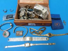 A collection of costume jewellery to include ladies wristwatches, silver chains,