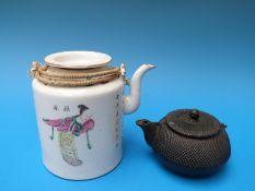 A 19thC Chinese porcelain teapot decorated with figures and calligraphy together with an iron