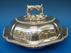 A Victorian hallmarked silver entrée dish with shaped gadrooned edge and crest with motto 
