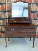 An inlaid mahogany mirror-backed dressing chest (W107 x D53 x L165cm)