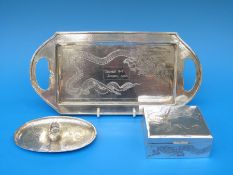 A Chinese white metal desk tray, pin tray and matching cigarette box with dragon decoration,