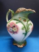 A decorative figural pedestal supported by three figures,