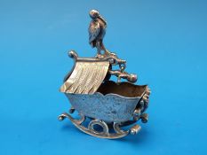 A white metal rocking crib with baby hanging above, length 4.