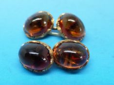 A pair of yellow metal cufflinks marked 585 (14ct) and set with citrine