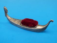 A hallmarked silver pin cushion in the form of a gondola, B'ham 1906,