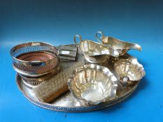 A collection of silver plate to include galleried tray, wine coasters,