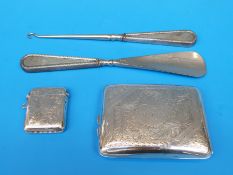 A hallmarked silver cigarette case and hallmarked silver vesta together with a hallmarked  silver