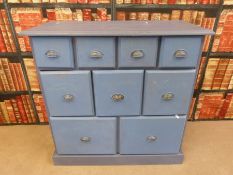 A painted pine chest of nine variously sized drawers (W87.5 x D40.