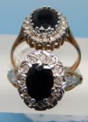 Two 9ct gold rings both set with a central sapphire surrounded by diamonds (size L/K)