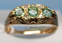 A 9ct gold ring set with three green stones with alternating diamonds (size N)