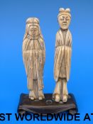 Two 18thC Chinese carved ivory figures mounted on a wooden base