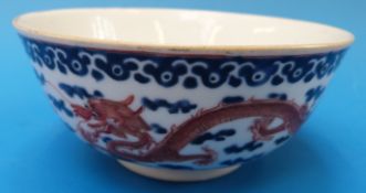 A 19thC Chinese blue and white bowl with dragon decoration