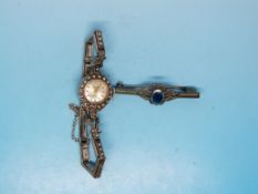 A hallmarked silver marcasite cocktail watch and a brooch marked silver