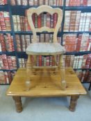 A pine coffee table together with a pine chair