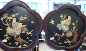A pair of Japanese Shibayama panels with figures of doves in relief upon a branch in ivory,