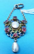 An Austro Hungarian white metal pendant set with a central pearl surrounded by six pink stones,