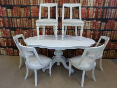 A painted dining table and six chairs