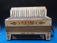 A 1930s Pietro 120 bass piano accordion,