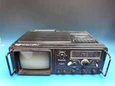 A c1970's vintage Plustron TVRC7 portable television, radio,
