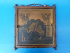 A three panelled Japanese mirror, the panels decorated with cranes and immortals,