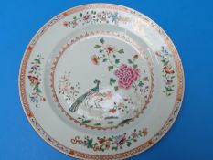 An 18thC Chinese polychrome decorated plate with peacock and bird decoration