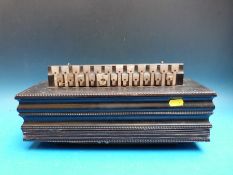 A c1870 flutina, 24 mother of pearl keys, two spoons bass and air button,