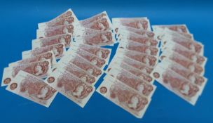 Twenty two J.Q Hollon 10 shilling notes together with 14 F.