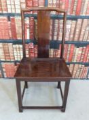 A hardwood Chinese chair with shaped splat back and all round stretcher