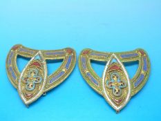 Two gilt buckles with enamelled decoration