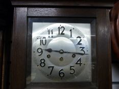 A C1910 oak cased three train wall clock