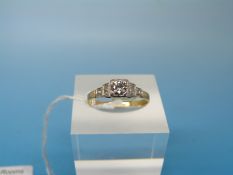 An Art Deco 18ct gold ring set with a round brilliant cut diamond measuring approx 0.