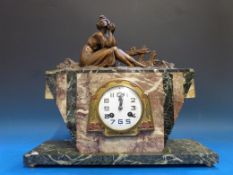 An Art Deco clock decorated with spelter surmount of a pensive lady signed Limousin