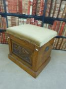 A 19thC carved oak commode,