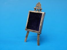 A hallmarked silver pin cushion in the form of an artist's easel by Sampson and Mordan, B'ham 1904,