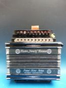 A vintage melodeon c1910 with three stops, two bass, two extra buttons for cuckoo effect,