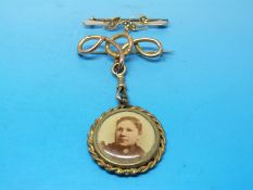 A hallmarked 15ct gold brooch set with seed pearls (Chester 1907) together with a yellow metal knot