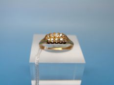 An 18ct gold ring set with two rows of diamonds (size M)
