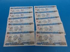 Ten consecutive 50 naqira Nigerian bank notes, all crisp and uncirculated,
