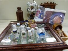 A collection of items to include thimbles in case and stand, Sooty egg cup and plates,