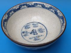 A 19thC Chinese blue and white pedestal crackle glazed bowl with Foo Dog decoration (10cm tall,