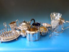A quantity of silver plate to include tea sets,