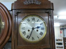 An c1910 oak cased two train wall clock by Wurttemberg Germany