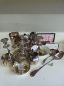 A quantity of silver plate including candelabra, tankards, basting spoon,