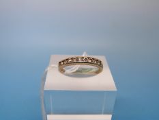 A yellow metal ring marked .