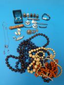 An ivory bead necklace together with a quantity of other necklaces, Niello ware brooches,