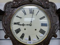 A 19thC carved oak wall clock